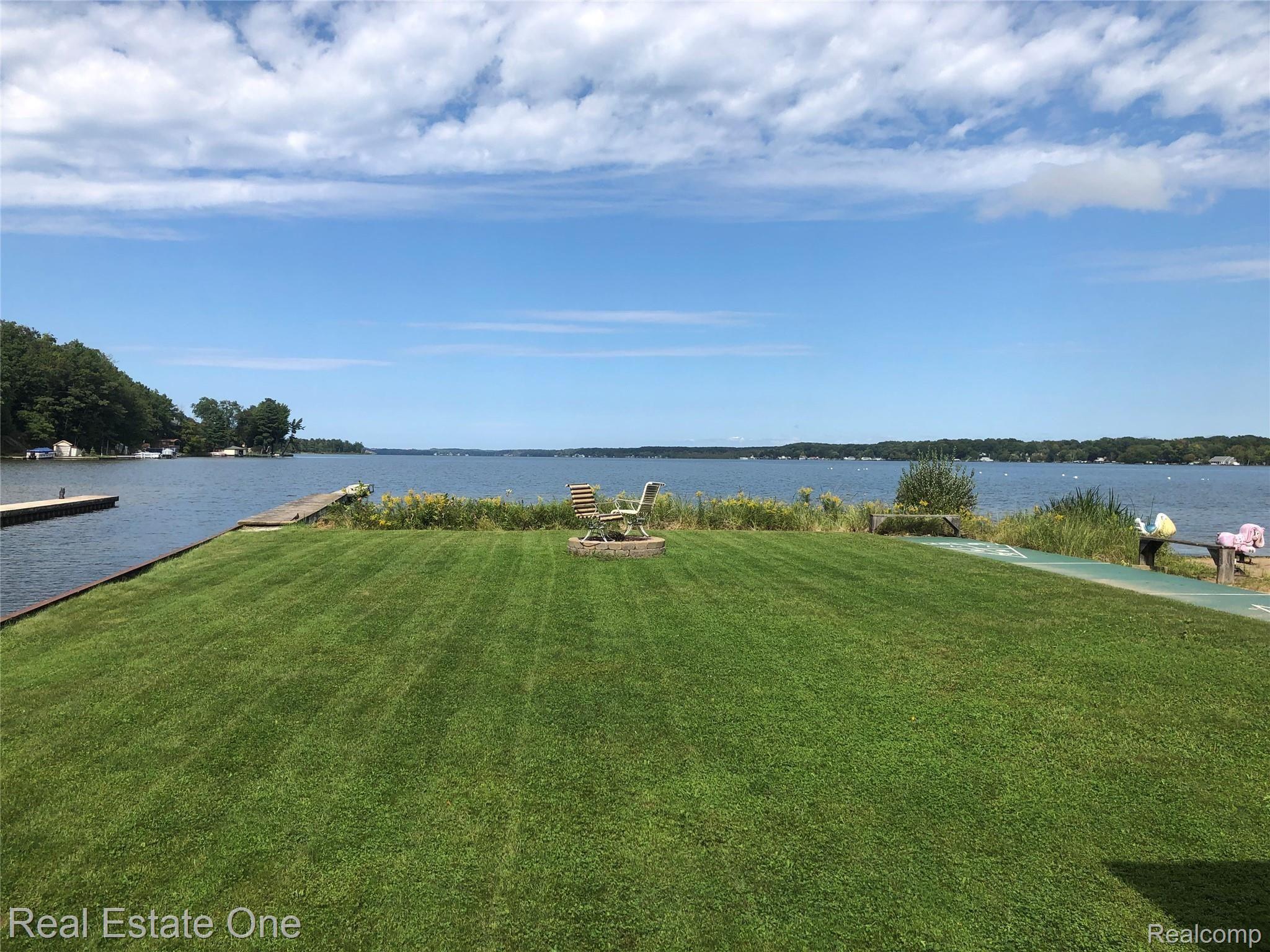 2722 Piney Ridge Road Ludington, MI 49431 - Photo 19 of 64 Canal from boat slips out to Hamlin. Community firepit shuffleboard and beach to the right