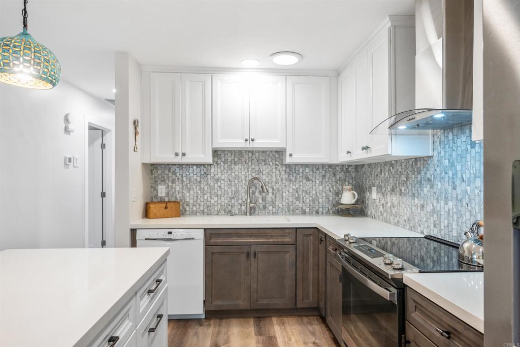 315 Volney Lane Encinitas, CA 92024 - Photo 12 of 51 a kitchen with stainless steel appliances a stove a sink and a refrigerator