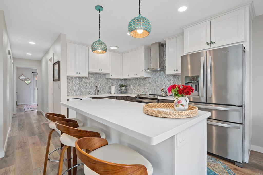 315 Volney Lane Encinitas, CA 92024 - Photo 13 of 51 a kitchen with stainless steel appliances granite countertop a sink refrigerator and microwave