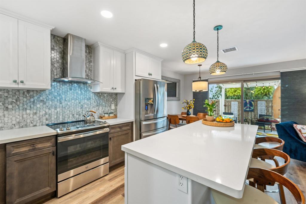 315 Volney Lane Encinitas, CA 92024 - Photo 15 of 51 a kitchen with sink a stove and refrigerator