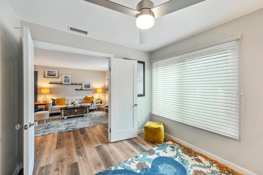 315 Volney Lane Encinitas, CA 92024 - Photo 25 of 51 a living room with a couch and a chandelier