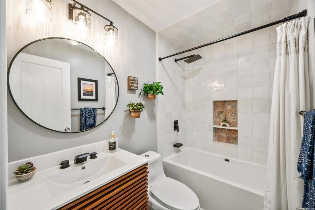 315 Volney Lane Encinitas, CA 92024 - Photo 26 of 51 a bathroom with a sink a toilet and a mirror