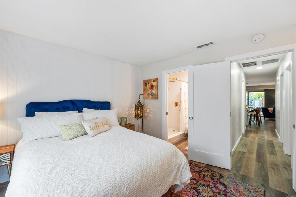 315 Volney Lane Encinitas, CA 92024 - Photo 31 of 51 a bedroom with a bed and a mirror