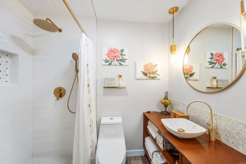 315 Volney Lane Encinitas, CA 92024 - Photo 33 of 51 a bathroom with a sink mirror vanity and toilet