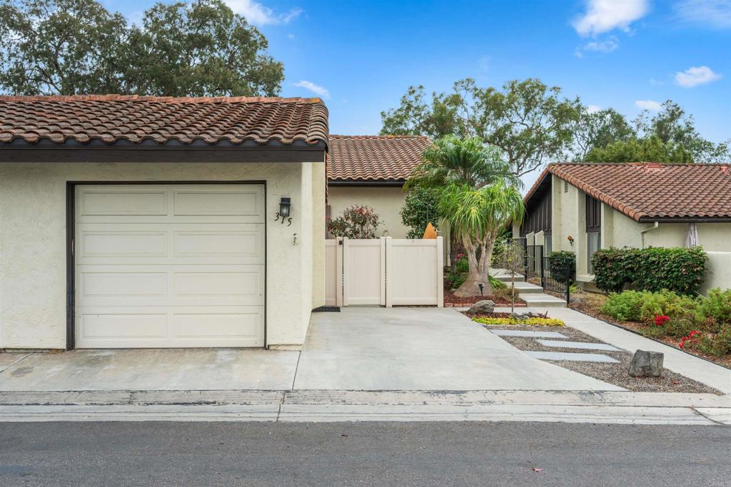 315 Volney Lane Encinitas, CA 92024 - Photo 4 of 51 a house that has a tree in front of it