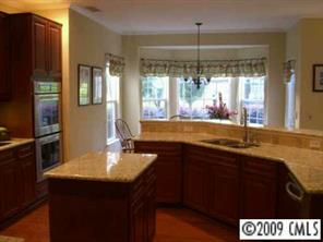 15819 Lavenham Road Huntersville, NC 28078 - Photo 5 of 8 a kitchen with a sink and a large window