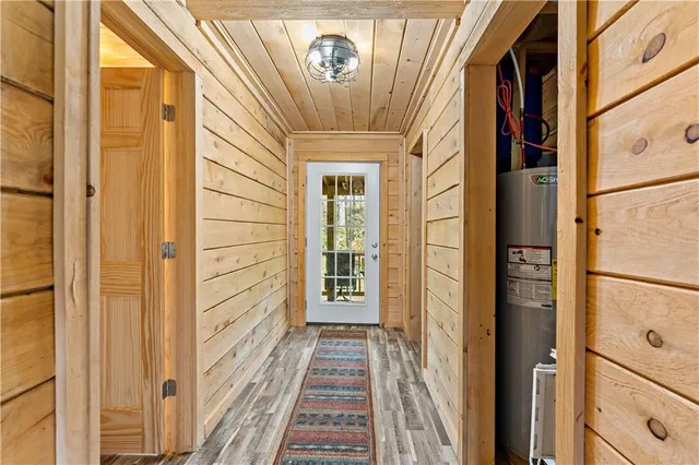 a view of a hallway with wooden door