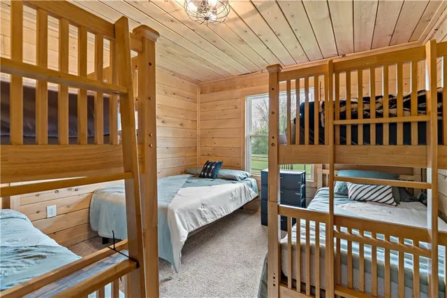 a bedroom with furniture and baby crib