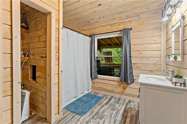 a view of a door and wooden floor