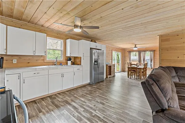 a kitchen with granite countertop lots of counter top space and cabinets