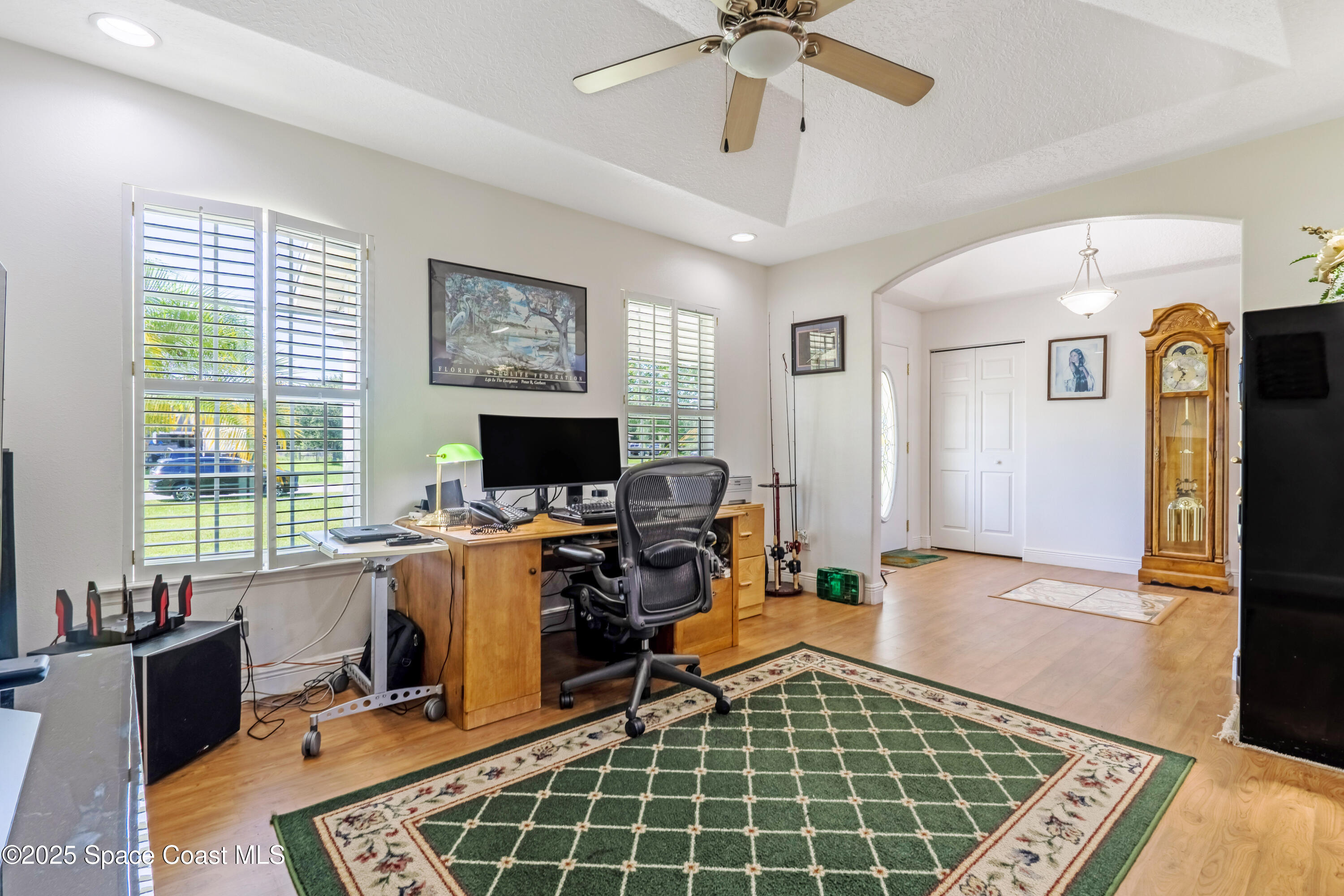 4985 Hamlin Circle Mims, FL 32754 - Photo 13 of 39 a view of a workspace with furniture and a window