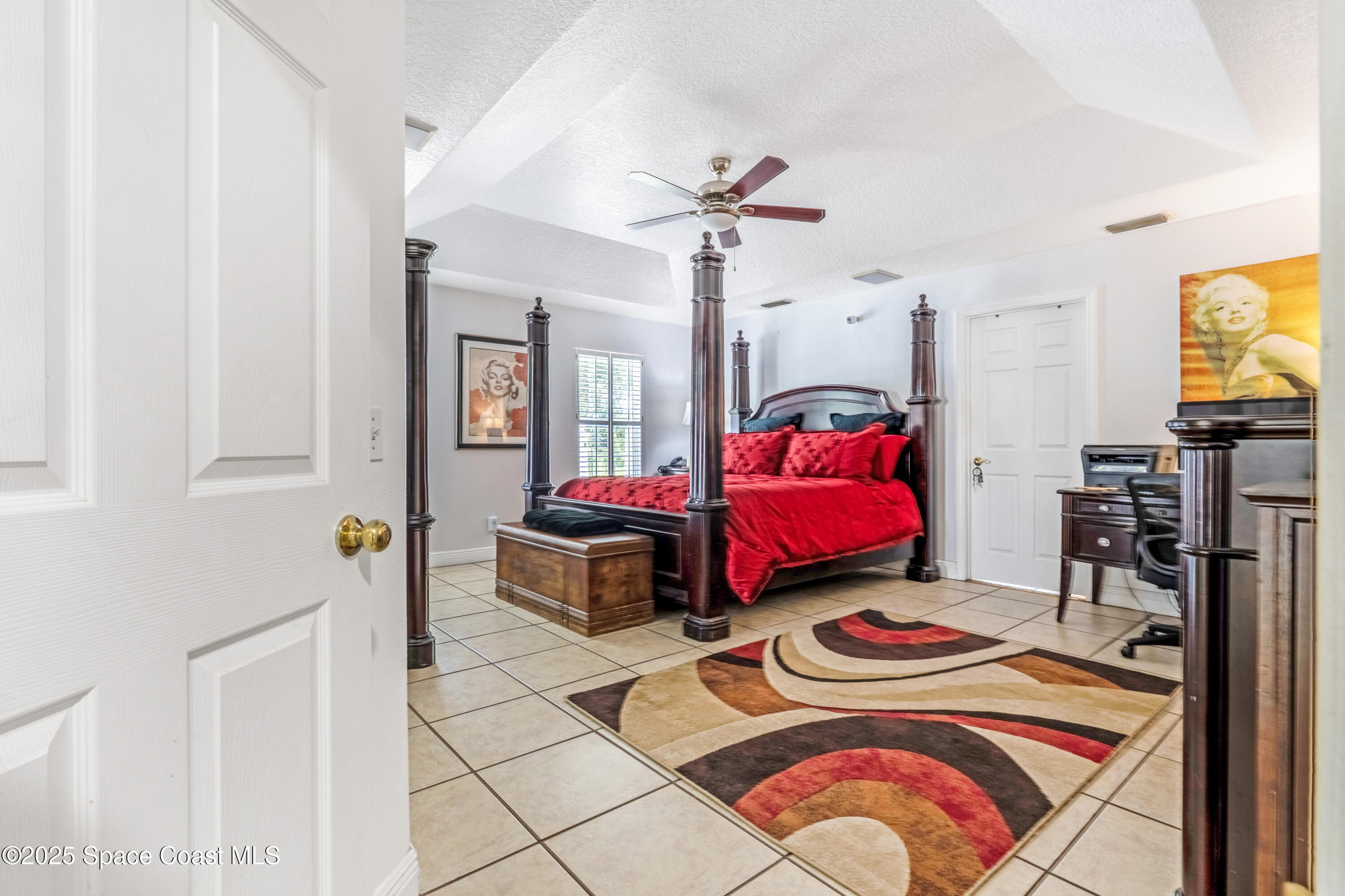 4985 Hamlin Circle Mims, FL 32754 - Photo 17 of 39 a bedroom with two beds and a chandelier