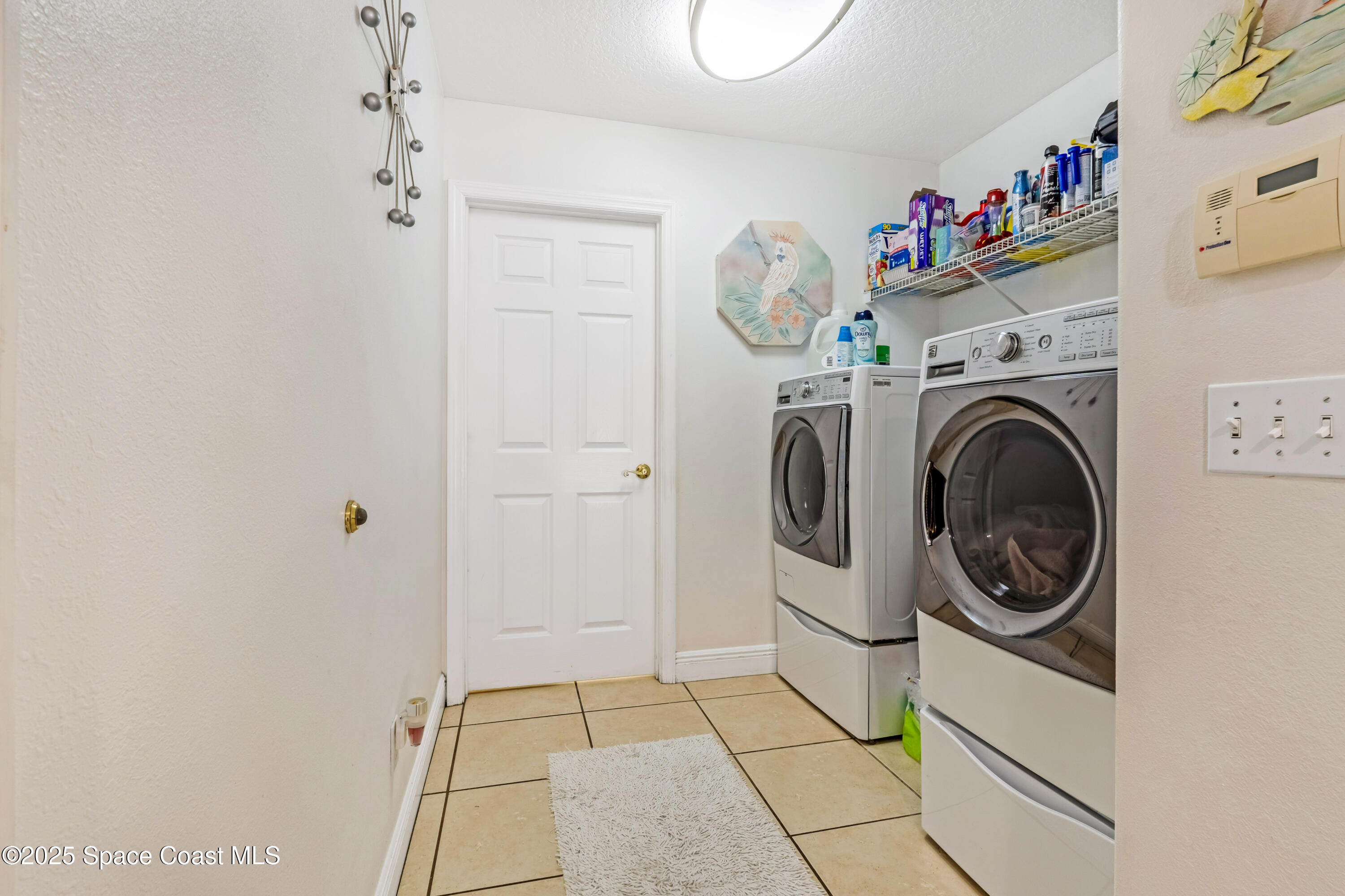 4985 Hamlin Circle Mims, FL 32754 - Photo 23 of 39 a utility room with dryer and washer