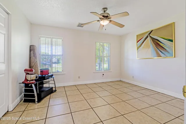 a view of room with window and fan