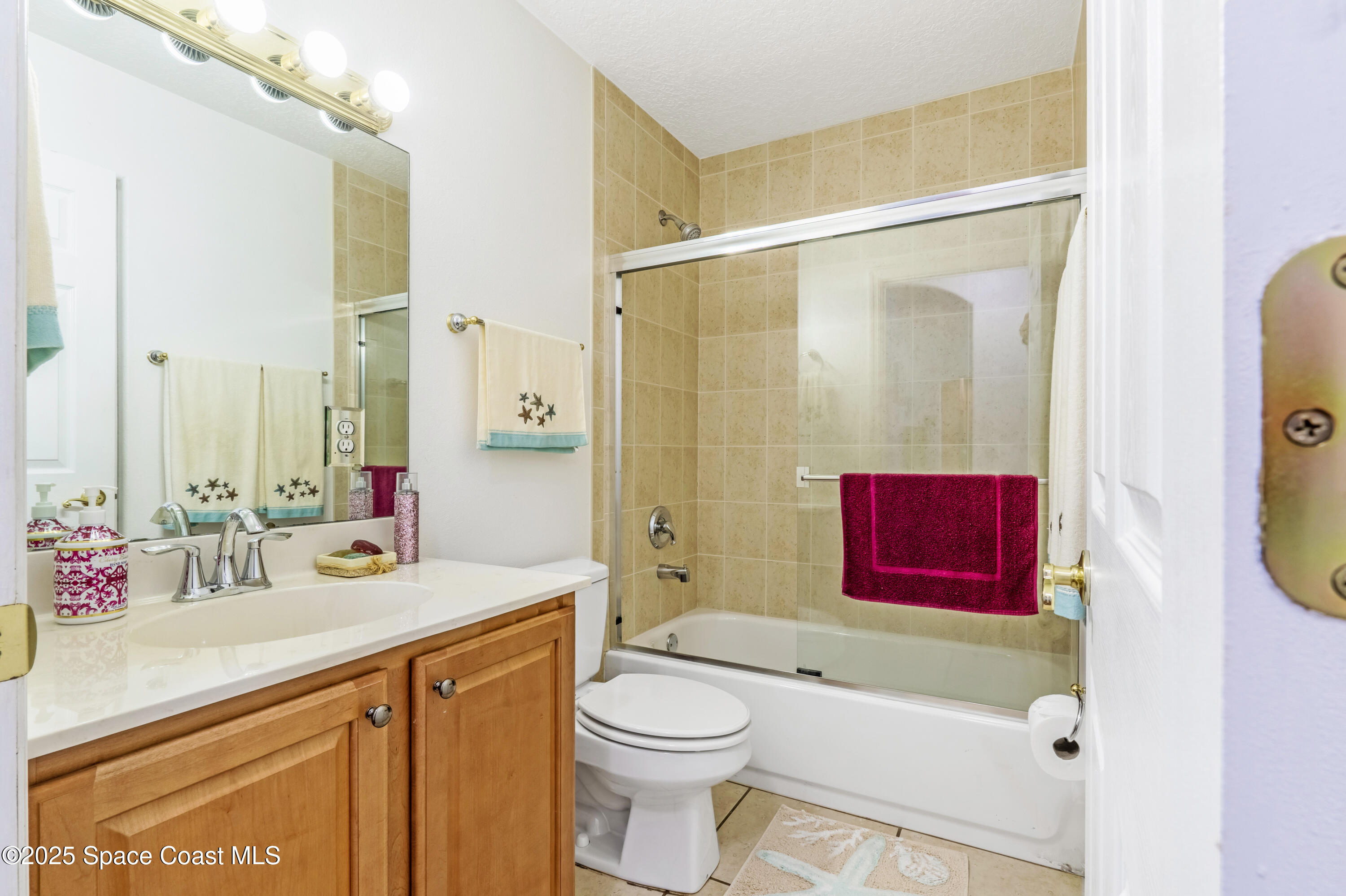 4985 Hamlin Circle Mims, FL 32754 - Photo 26 of 39 a bathroom with a sink a toilet and shower