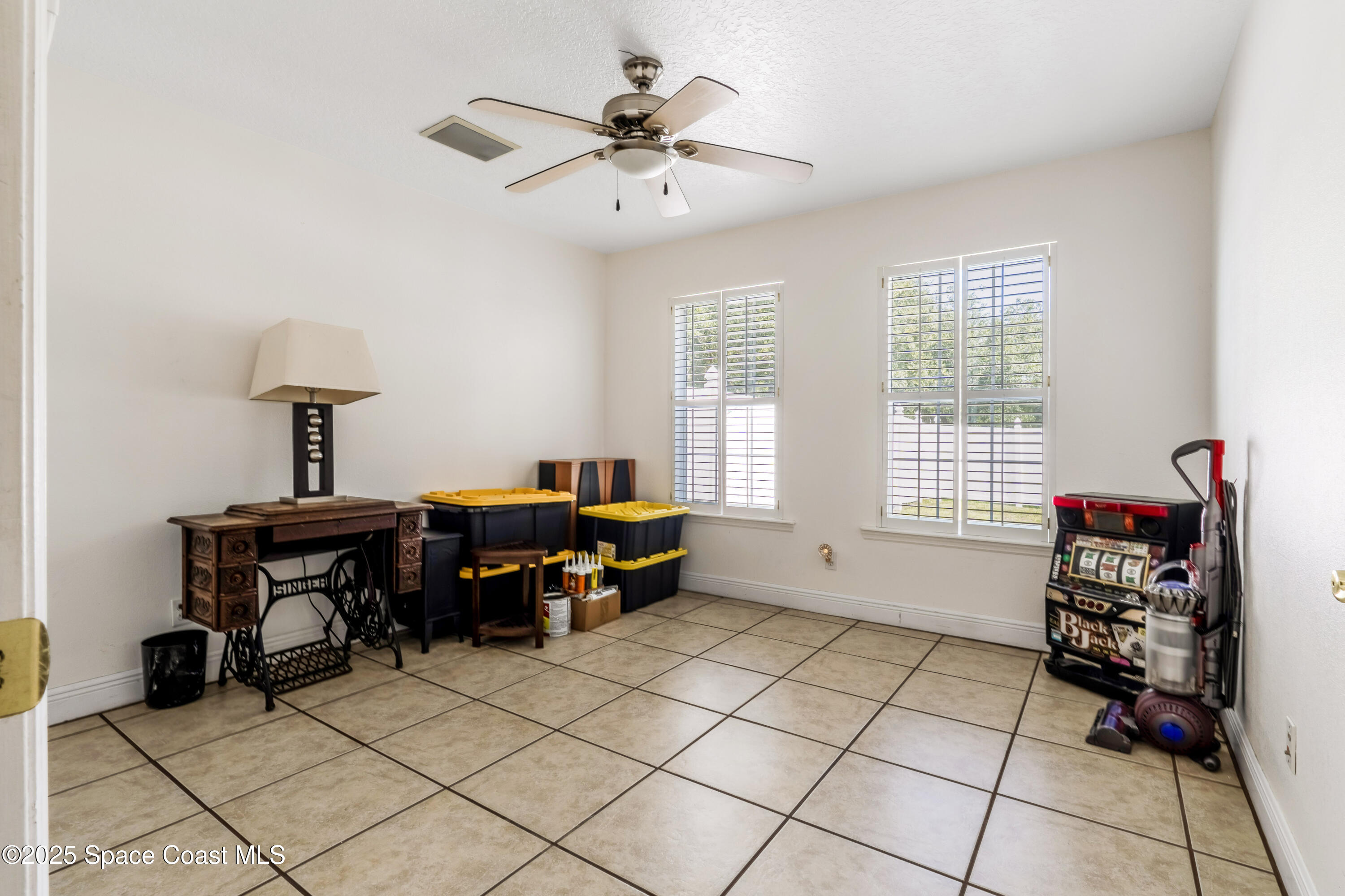 4985 Hamlin Circle Mims, FL 32754 - Photo 27 of 39 a living room with furniture and a window