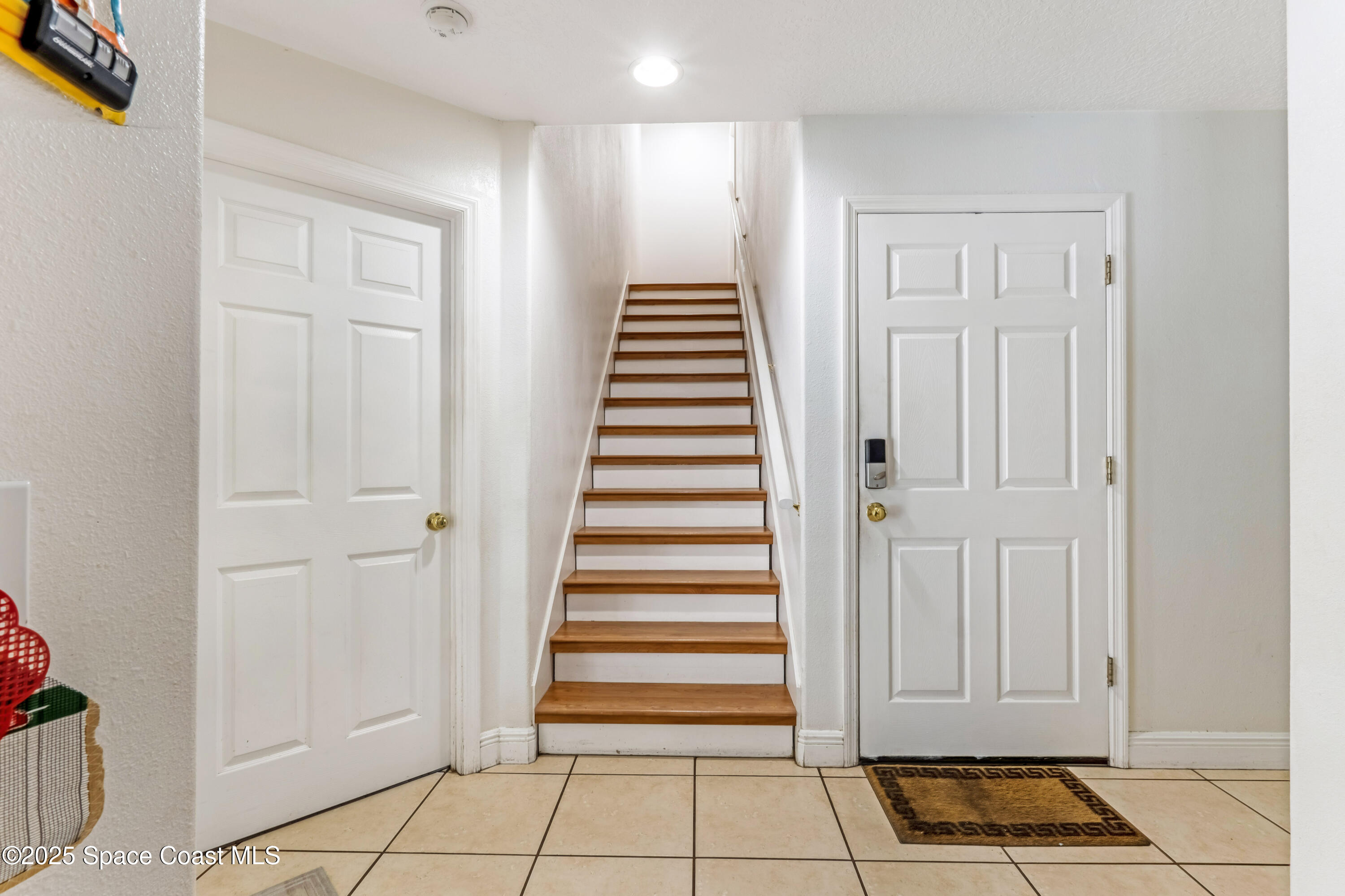 4985 Hamlin Circle Mims, FL 32754 - Photo 29 of 39 a view of entryway with white walls and a window