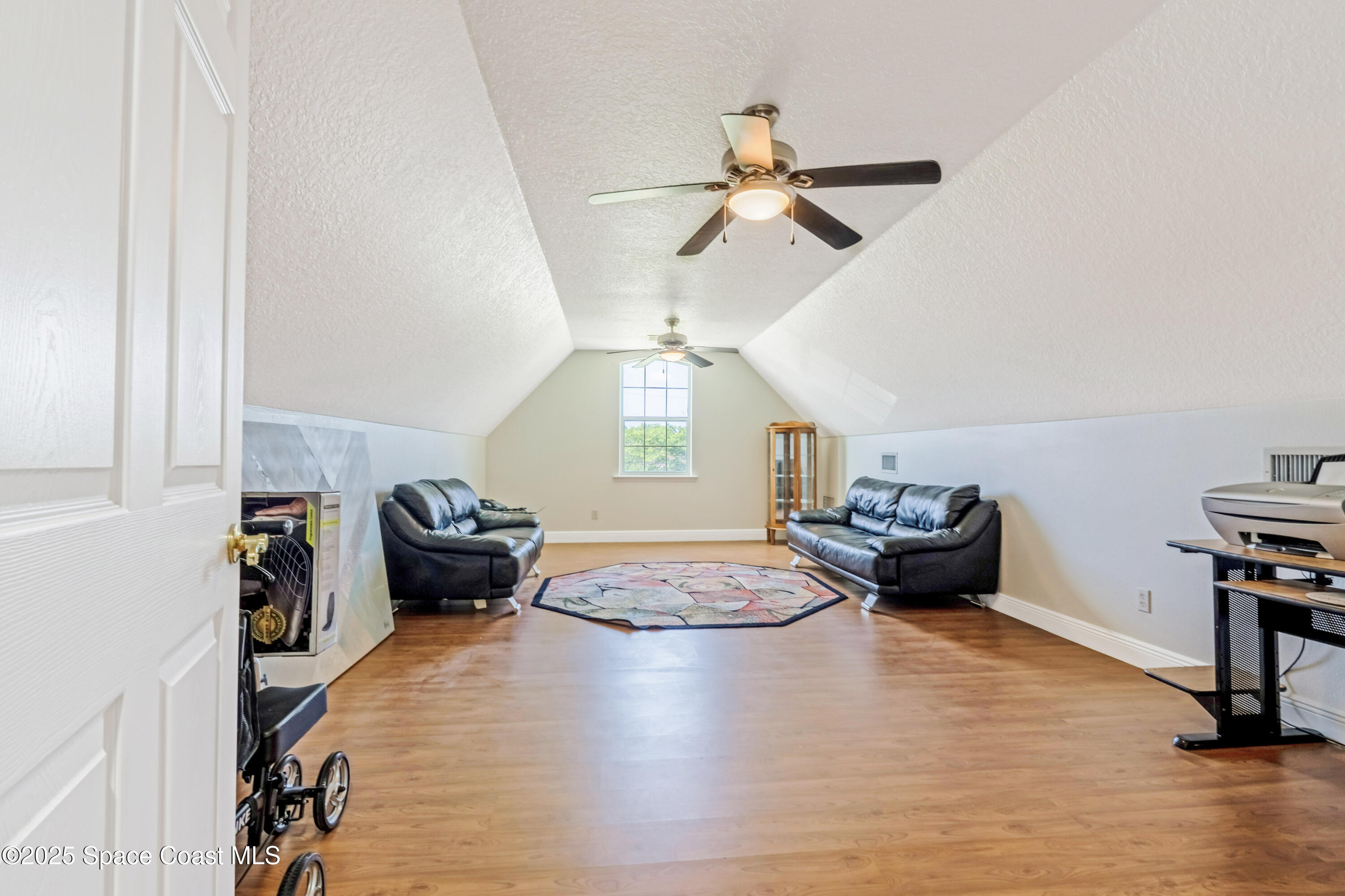 4985 Hamlin Circle Mims, FL 32754 - Photo 30 of 39 a living room with furniture and a wooden floor