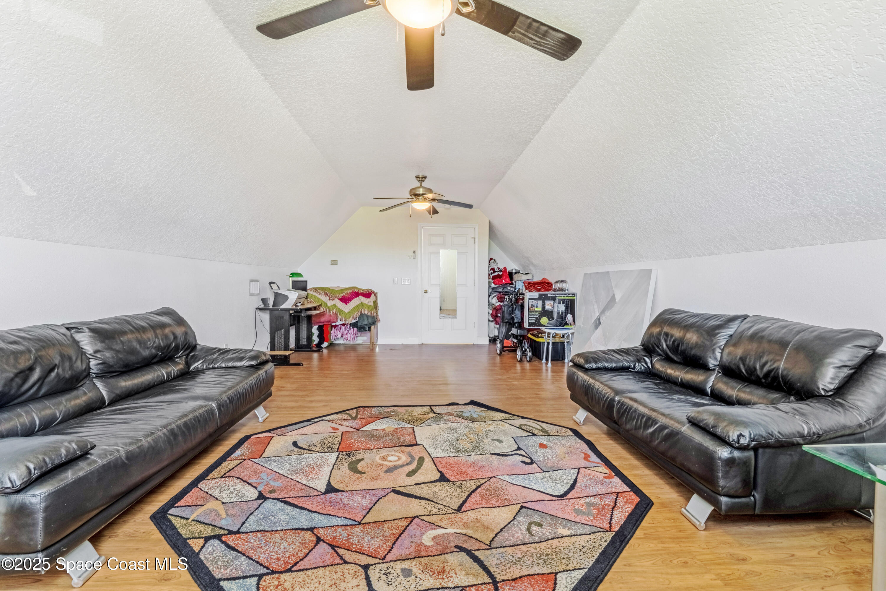 4985 Hamlin Circle Mims, FL 32754 - Photo 31 of 39 a living room with furniture and a wooden floor