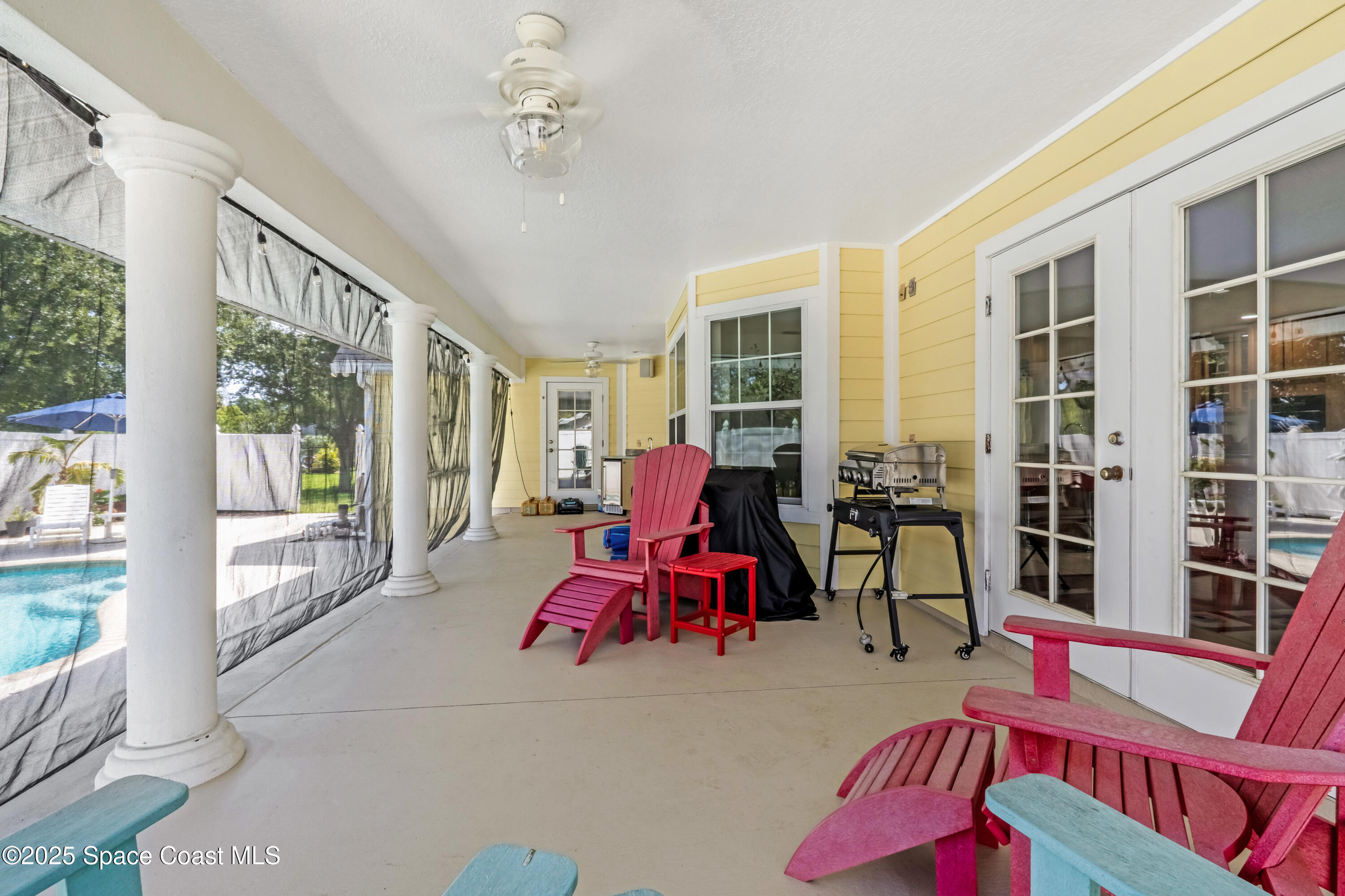 4985 Hamlin Circle Mims, FL 32754 - Photo 32 of 39 a living room with furniture and large windows