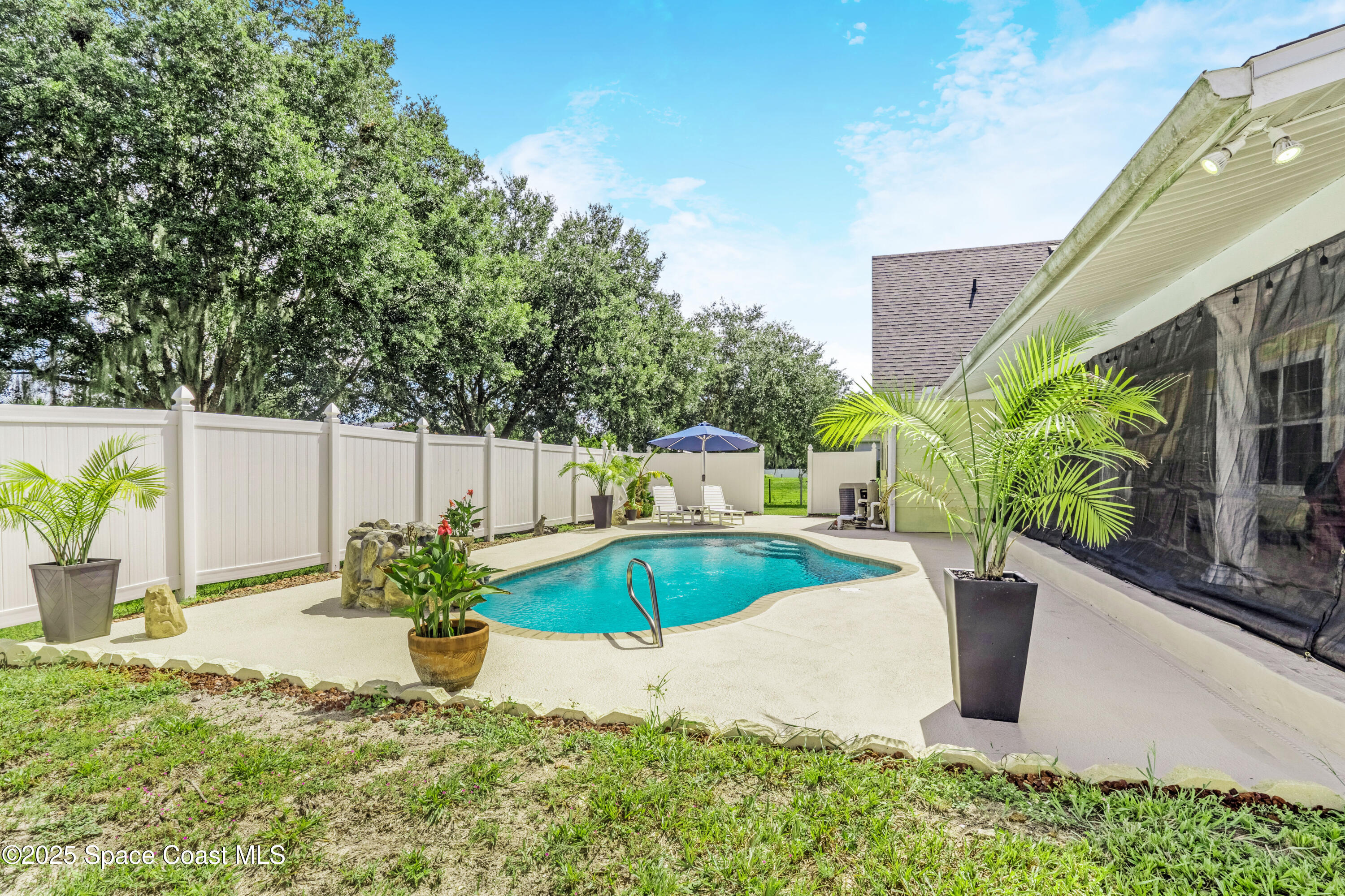 4985 Hamlin Circle Mims, FL 32754 - Photo 35 of 39 a view of a backyard