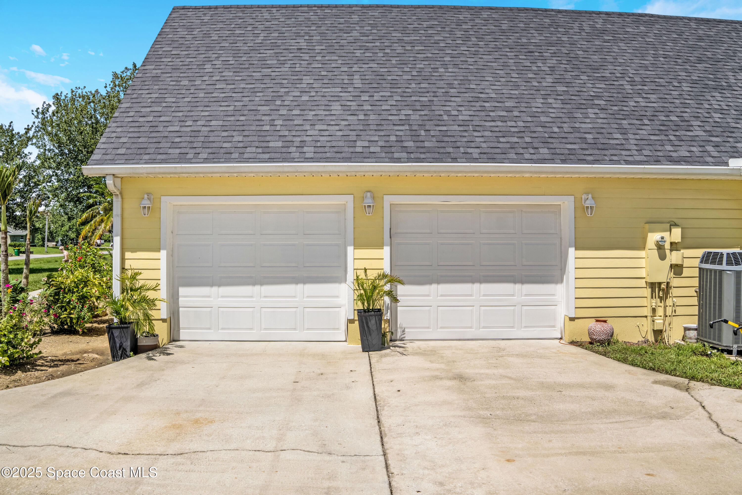 4985 Hamlin Circle Mims, FL 32754 - Photo 5 of 39 a front view of a house with a parking area