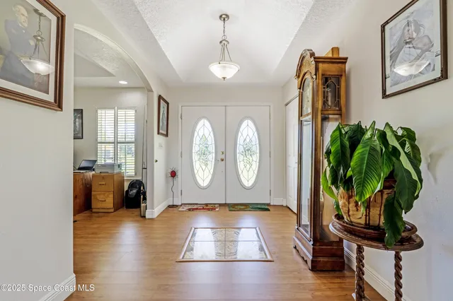 a view of entryway with wooden floor