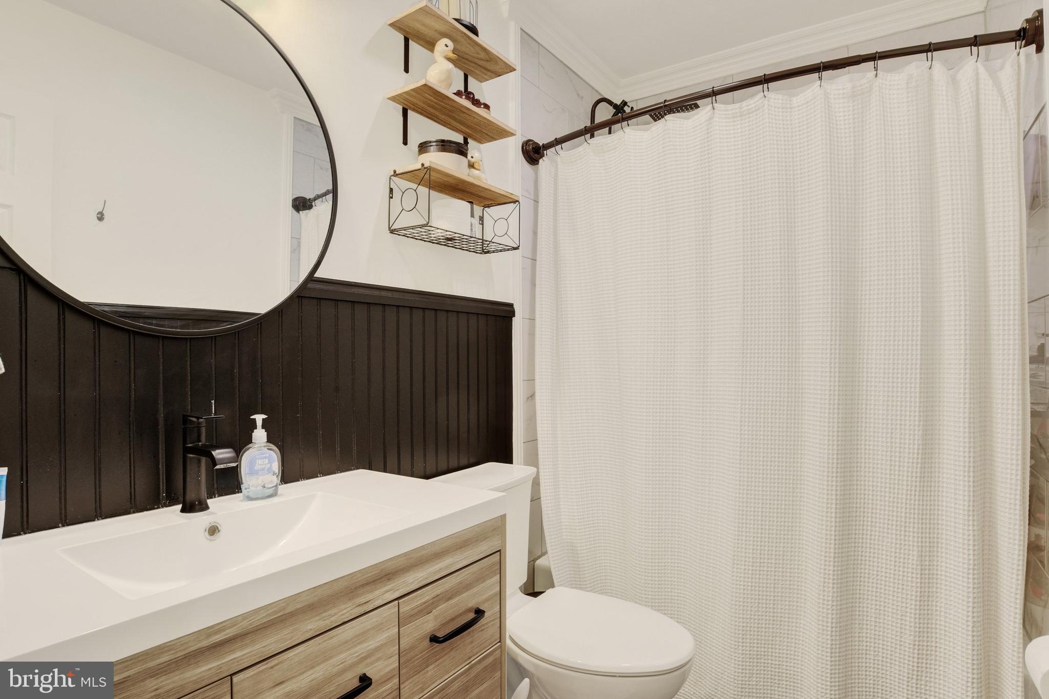 329 South Crawford Road Hummelstown, PA 17036 - Photo 8 of 17 a bathroom with a sink and a mirror