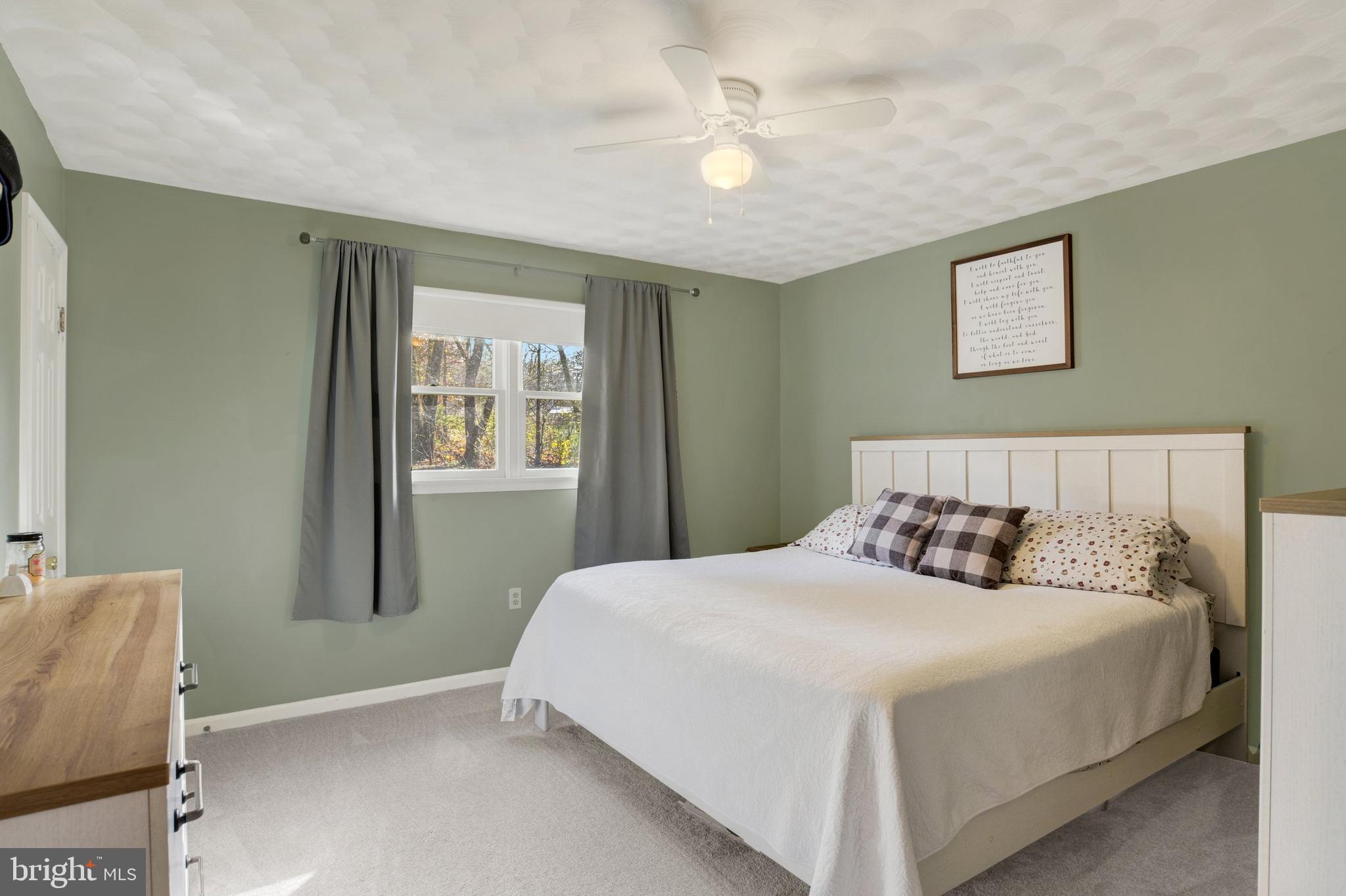 329 South Crawford Road Hummelstown, PA 17036 - Photo 9 of 17 a bedroom with a large bed and a chandelier