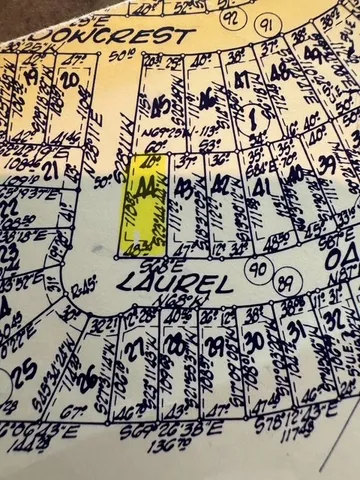 walk in wooden floor with a white wall