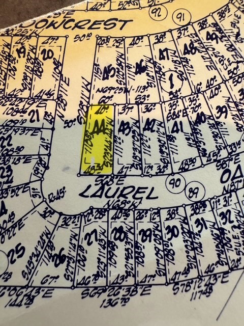 walk in wooden floor with a white wall