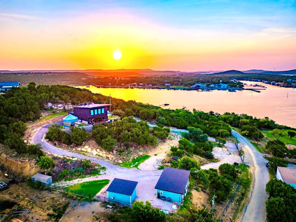 4468 Chapel Road Graham, TX 76450 - Photo 2 of 39 Spectacular Sunsets, and so much room to Entertain after a Great Day on the Lake with Friends and Family with your own Private Waterfront Lot.