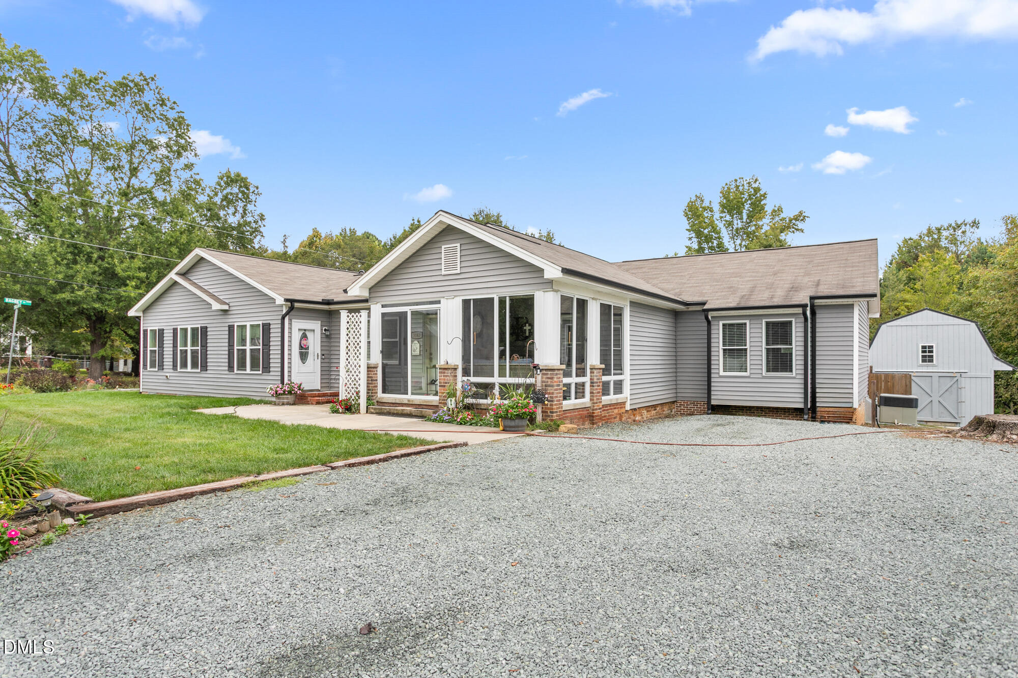 3163 Saul Loop Road Elon, NC 27244 - Photo 3 of 44 a front view of a house with garden