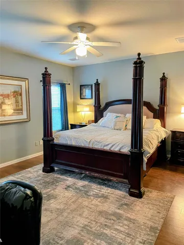 a bed room with a bed and a chandelier