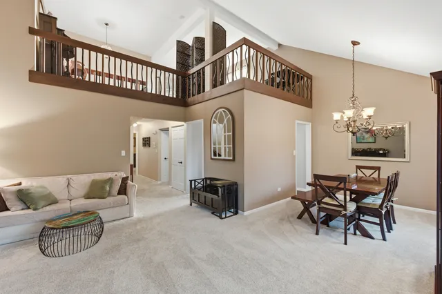 a view of living room with furniture and a flat screen tv