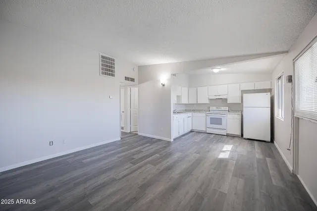a view of kitchen with wooden floor