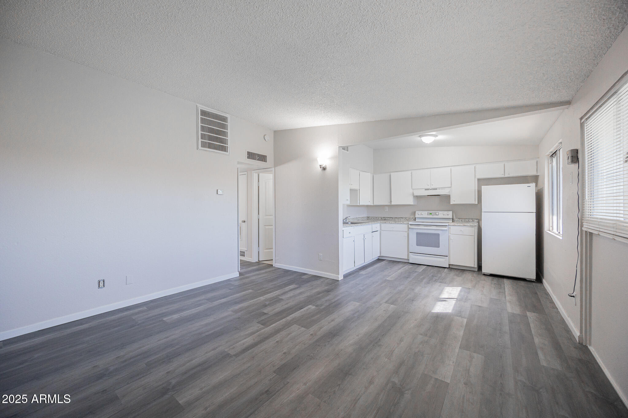 2123 West Devonshire Avenue, Unit 14 Phoenix, AZ 85015 - Photo 4 of 13 a view of kitchen with wooden floor