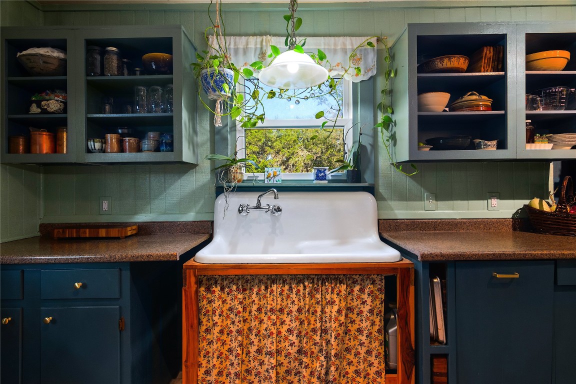 435 Spangenberg Road Blanco, TX 78606 - Photo 14 of 40 a room with lots of books and cabinets