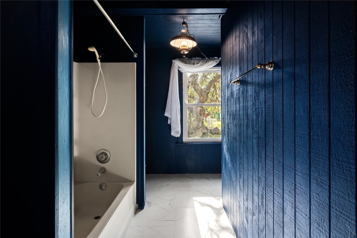 435 Spangenberg Road Blanco, TX 78606 - Photo 22 of 40 a bathroom with a bathtub and shower