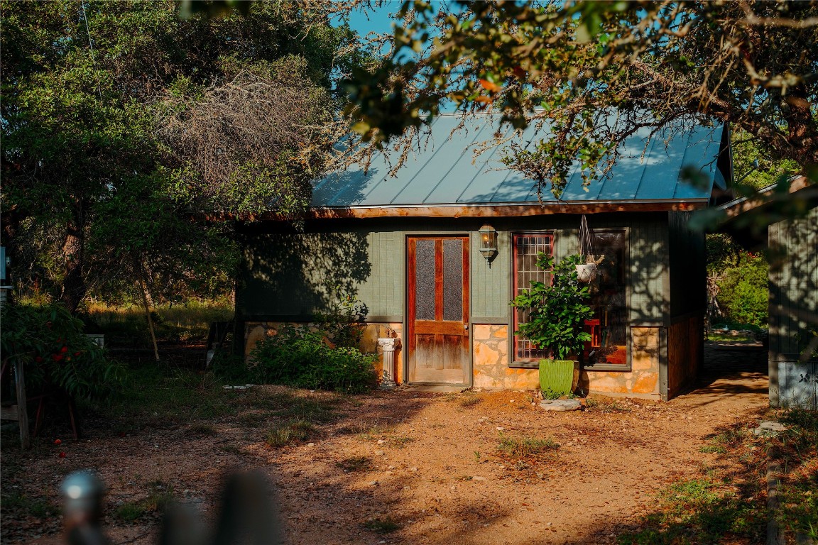 435 Spangenberg Road Blanco, TX 78606 - Photo 24 of 40 a front view of a house with a yard and tree