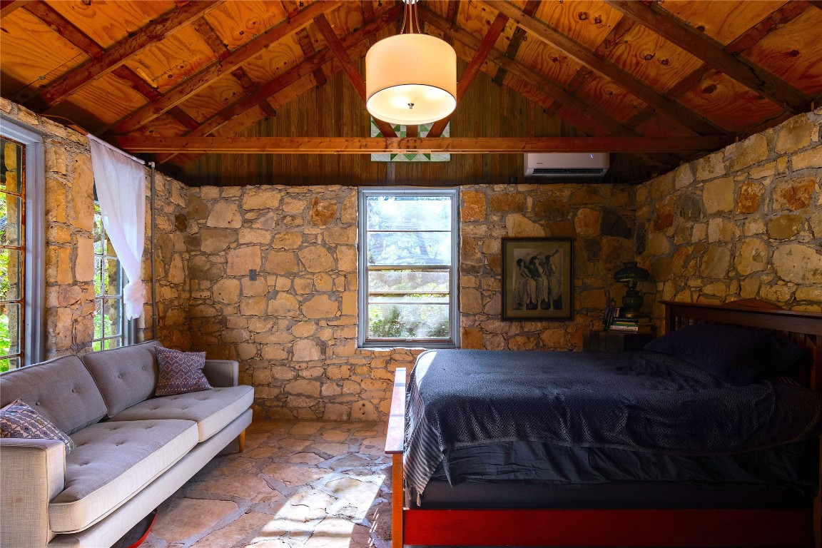 435 Spangenberg Road Blanco, TX 78606 - Photo 29 of 40 a bedroom with a bed window and couch