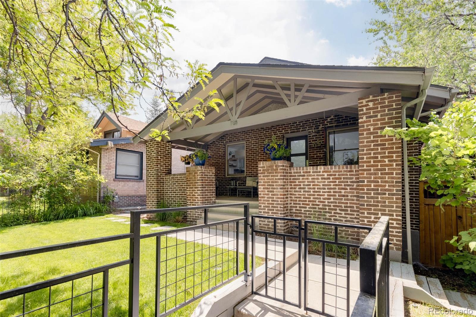 a view of a house with large windows