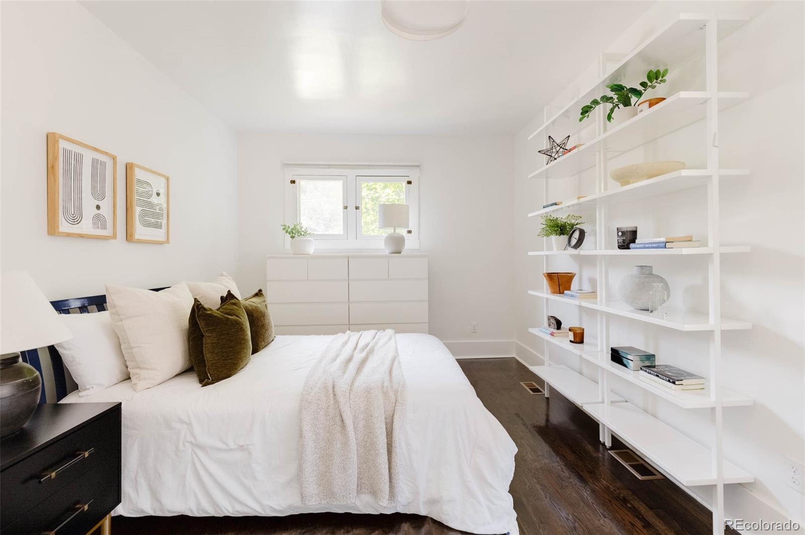 725 Monroe Street Denver, CO 80206 - Photo 16 of 33 a bedroom with a bed and a window