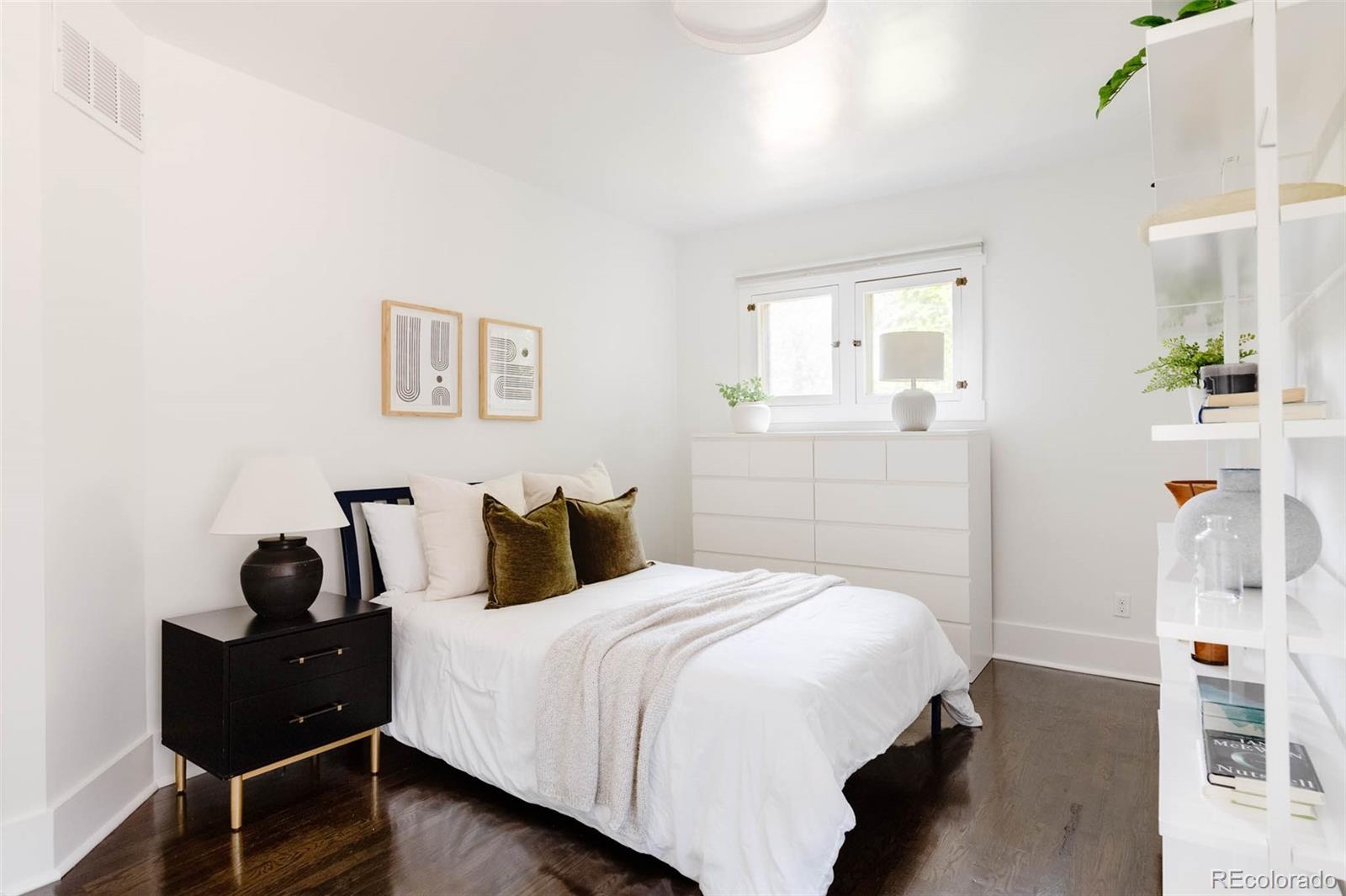 725 Monroe Street Denver, CO 80206 - Photo 17 of 33 a bedroom with a bed and wooden floor