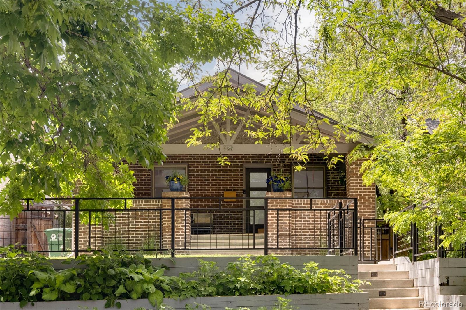 725 Monroe Street Denver, CO 80206 - Photo 2 of 33 a front view of a house with garden