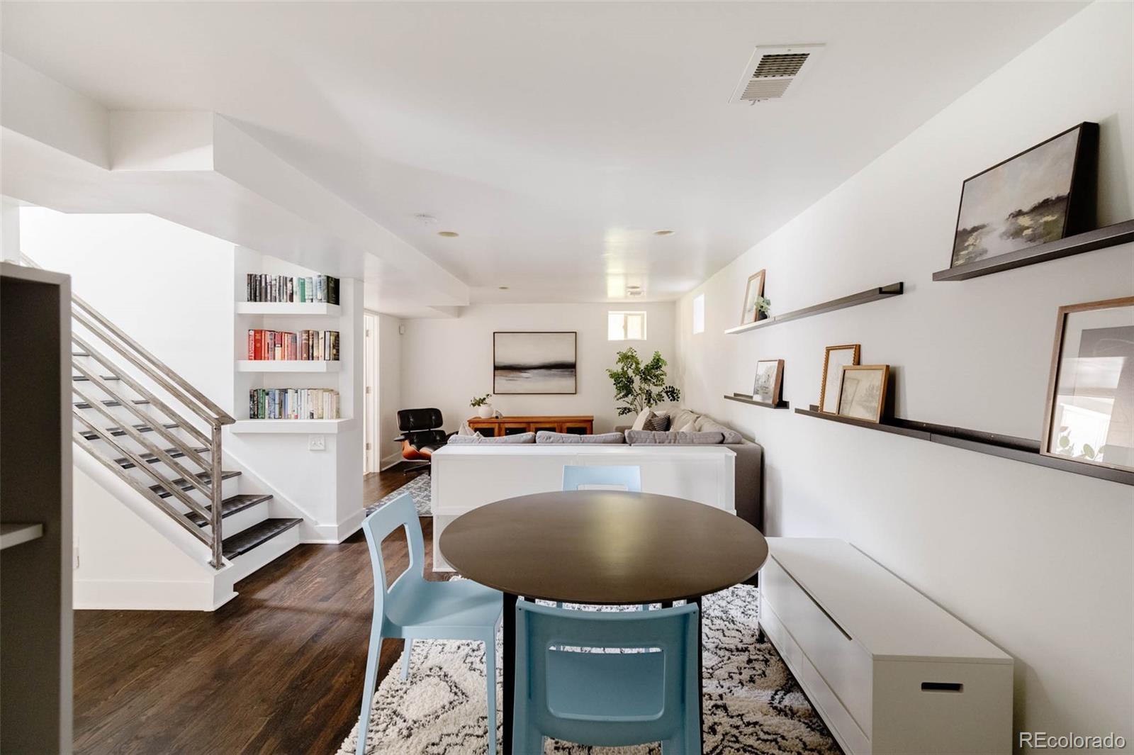 725 Monroe Street Denver, CO 80206 - Photo 23 of 33 a living room with furniture and a couch