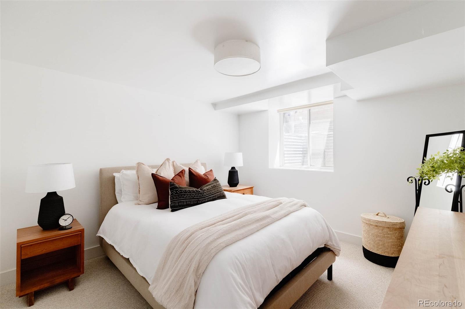 725 Monroe Street Denver, CO 80206 - Photo 24 of 33 a bedroom with bed and window
