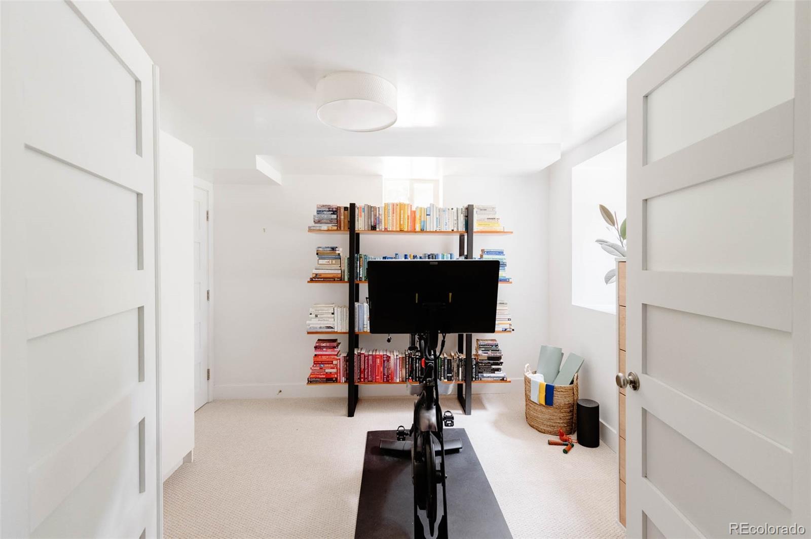 725 Monroe Street Denver, CO 80206 - Photo 25 of 33 a view of a workspace with furniture and a window