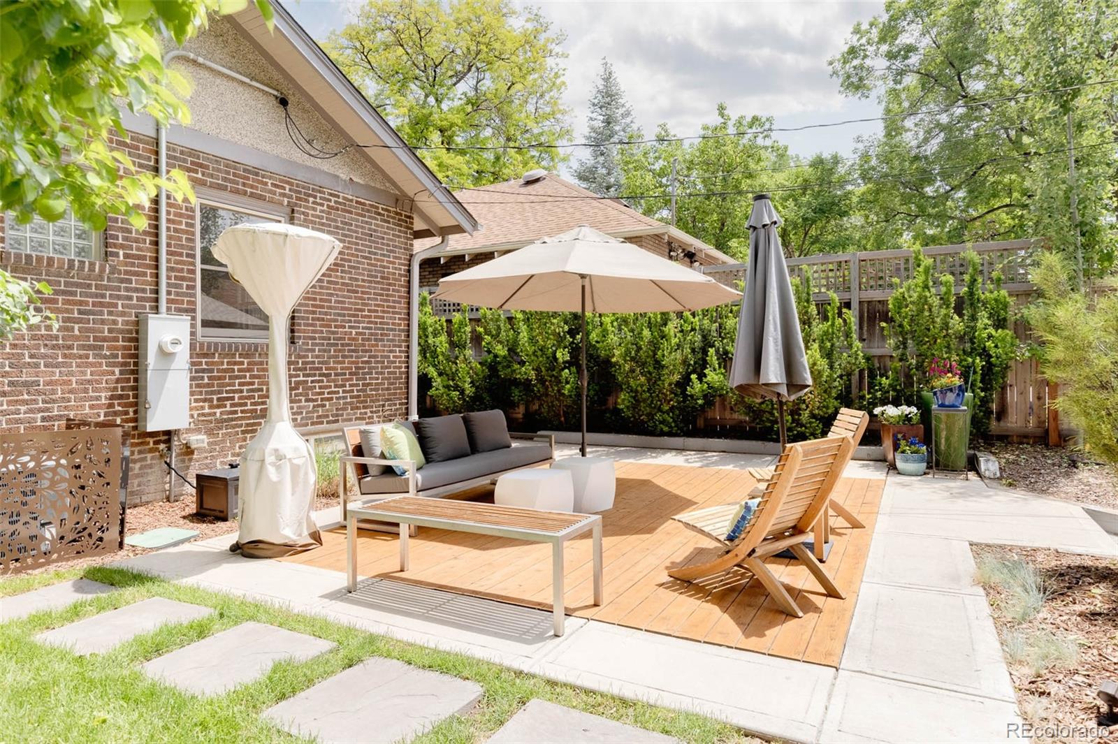 725 Monroe Street Denver, CO 80206 - Photo 30 of 33 a view of a backyard with a patio and fire pit