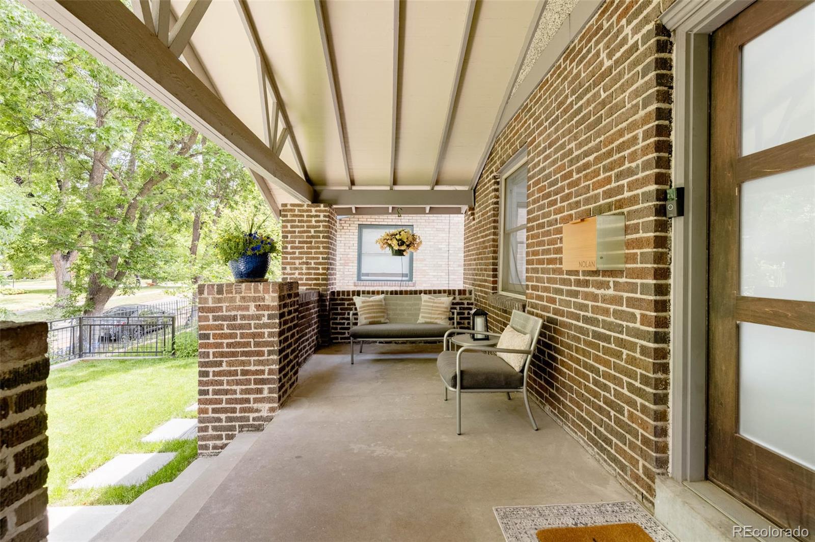 725 Monroe Street Denver, CO 80206 - Photo 33 of 33 a balcony with furniture and wooden floor